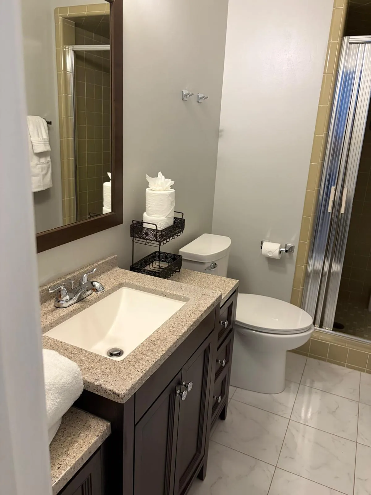 Bathroom with dark vanity and granite counter