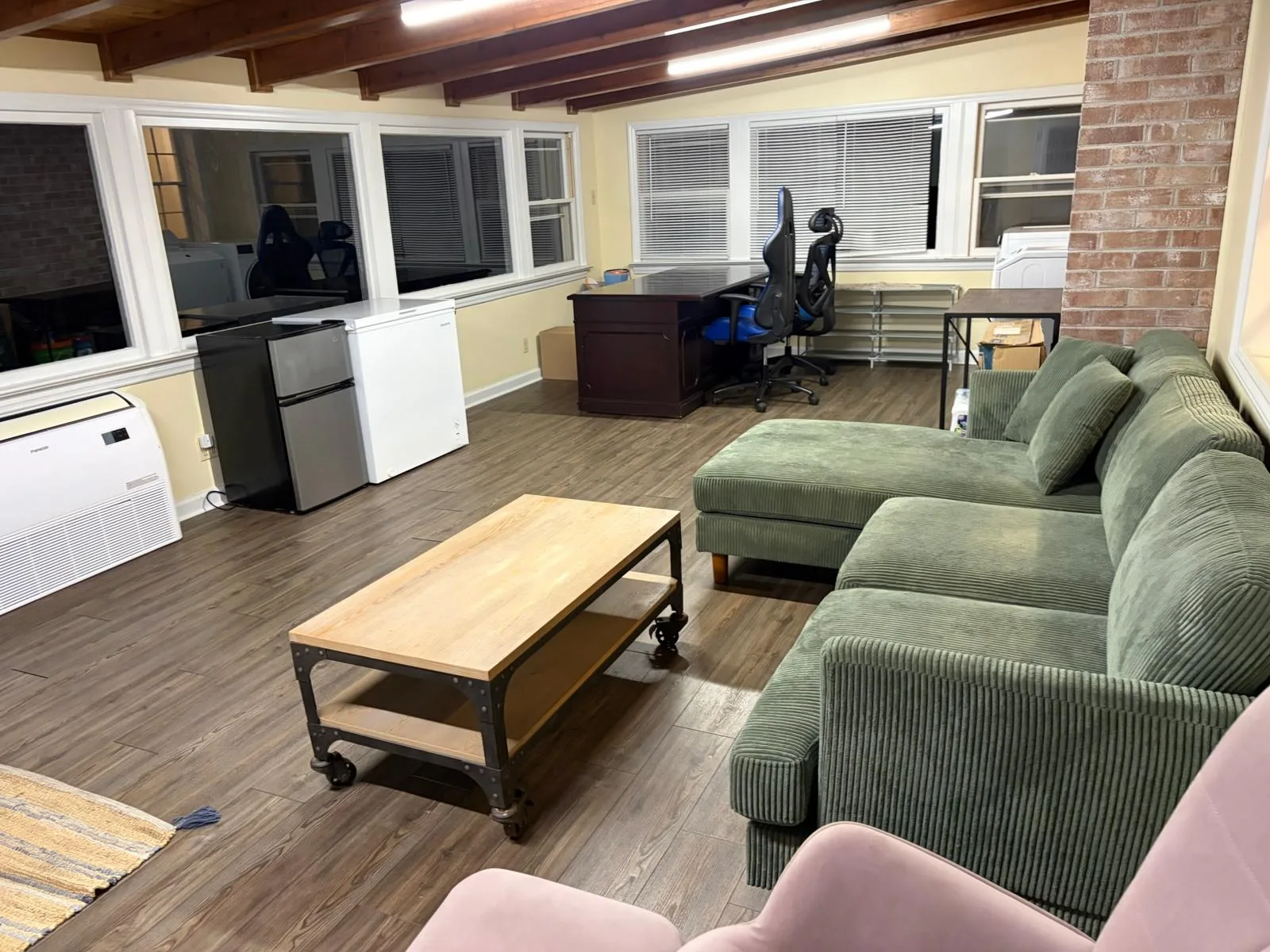 Bonus room with sectional sofa and desk